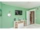 Inviting bedroom with a TV, white dresser, and decorative accents, offering a tranquil and stylish retreat at 102 & 104 48Th St, Holmes Beach, FL 34217