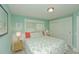 Comfortable bedroom offers natural light, neutral colors, and closet space at 102 & 104 48Th St, Holmes Beach, FL 34217