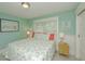 Cozy bedroom featuring bright colors, serene decor, and comfortable queen bed at 102 & 104 48Th St, Holmes Beach, FL 34217