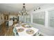 Eat-in dining room has nautical-themed decor, views to the modern kitchen, and beachy color palette at 102 & 104 48Th St, Holmes Beach, FL 34217