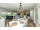 Open-concept living space showcases dining area, living room and kitchen at 102 & 104 48Th St, Holmes Beach, FL 34217