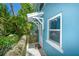 Charming home features an inviting front door, window, and well-manicured landscaping at 102 & 104 48Th St, Holmes Beach, FL 34217