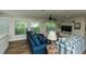 Airy living room with plenty of windows, comfortable seating, and beachy decor at 102 & 104 48Th St, Holmes Beach, FL 34217