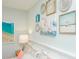 This bedroom features beachy-themed pictures hanging above the headboard at 102 & 104 48Th St, Holmes Beach, FL 34217