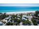 Expansive ocean view from a residential area with multiple homes close to white sandy beach at 102 & 104 48Th St, Holmes Beach, FL 34217