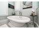 Elegant bathroom with a freestanding tub, stylish fixtures, and serene decor at 102 & 104 48Th St, Holmes Beach, FL 34217