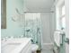 Charming bathroom with a mermaid wall decor and a tub at 102 & 104 48Th St, Holmes Beach, FL 34217