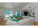 Open living area with built-in shelving, large sectional, and beach views at 102 & 104 48Th St, Holmes Beach, FL 34217