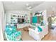 Bright living room featuring coastal decor, wood floors, and comfortable seating at 102 & 104 48Th St, Holmes Beach, FL 34217