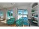 Bright living room with water views and comfortable seating at 102 & 104 48Th St, Holmes Beach, FL 34217