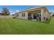 Spacious backyard with well-maintained lawn, patio, and privacy fence at 11513 11Th E Ave, Bradenton, FL 34212