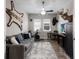 A versatile room showcasing a ceiling fan, desk, exercise bike, and wall decorations at 11513 11Th E Ave, Bradenton, FL 34212
