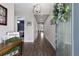 Open foyer showcasing wood flooring, a decorative chandelier, and an inviting entrance at 11513 11Th E Ave, Bradenton, FL 34212