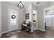 Inviting foyer featuring wood floors, a decorative chandelier, and a white door with glass at 11513 11Th E Ave, Bradenton, FL 34212