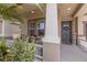 Inviting front porch with comfortable seating area and neutral color palette at 11513 11Th E Ave, Bradenton, FL 34212