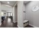 Hallway featuring wood-look tile flooring, neutral walls, and a cozy bench with drawers at 11513 11Th E Ave, Bradenton, FL 34212