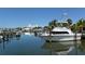Daytime view of private boat dock, with yachts, providing easy access to the water for boating and water activities at 120 Hammock Rd, Anna Maria, FL 34216