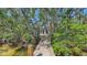 View of the private dock leading to the waterfront at 120 Hammock Rd, Anna Maria, FL 34216