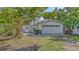 Charming single-story home with a two-car garage and a well-maintained front yard at 120 Hammock Rd, Anna Maria, FL 34216