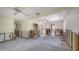 Renovation-ready living room with abundant natural light and ceiling fans at 120 Hammock Rd, Anna Maria, FL 34216