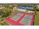 Aerial view of the tennis courts, swimming pool, and lake at this desirable community at 1214 56Th W St # 1214, Bradenton, FL 34209