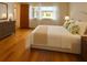 Inviting bedroom with hardwood floors and soft natural light at 1214 56Th W St # 1214, Bradenton, FL 34209