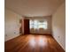 Spacious bedroom with hardwood floors and bright natural light from two windows at 1214 56Th W St # 1214, Bradenton, FL 34209