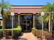 Exterior shot of the community clubhouse, showcasing the building's entrance and landscaping at 1214 56Th W St # 1214, Bradenton, FL 34209