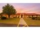 Charming single-story building with beautiful red tile roof and well-manicured lawn and shrubbery at 1214 56Th W St # 1214, Bradenton, FL 34209