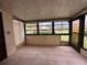 Enclosed lanai with tile flooring and screens, offering a view of the property's exterior at 1214 56Th W St # 1214, Bradenton, FL 34209