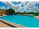 Resort-style swimming pool with comfortable lounging and a kiddie play area near a lovely lake at 1214 56Th W St # 1214, Bradenton, FL 34209