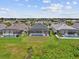 Backyard view of several screened-in pools and lawns in a beautiful suburban community at 12339 Glenridge Ln, Parrish, FL 34219