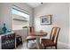 Cozy breakfast nook featuring a small table set, window and an adjacent beverage cooler at 12339 Glenridge Ln, Parrish, FL 34219