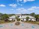 Community clubhouse features lush landscaping, palm trees, and accessible parking spaces at 12339 Glenridge Ln, Parrish, FL 34219