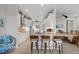 Modern, eat-in kitchen with granite countertops, stainless steel appliances, breakfast bar, and white cabinetry at 12339 Glenridge Ln, Parrish, FL 34219