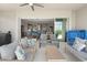 Comfortable outdoor lanai with ceiling fan and sliding glass doors to the home's living areas at 12339 Glenridge Ln, Parrish, FL 34219
