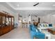 Spacious living area with tiled floors, stylish furniture and decor, opening up to the kitchen and dining area at 12339 Glenridge Ln, Parrish, FL 34219