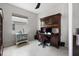 Comfortable home office setup with a large window, a built-in desk, and ample storage space at 12339 Glenridge Ln, Parrish, FL 34219
