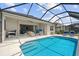 Gorgeous backyard oasis with a screened-in pool and patio area, perfect for outdoor living at 12339 Glenridge Ln, Parrish, FL 34219
