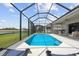 Screened-in pool with outdoor seating, perfect for relaxation and entertaining with lake views in the backyard at 12339 Glenridge Ln, Parrish, FL 34219