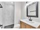 Modern bathroom with stylish vanity, updated faucet, and newly tiled shower at 1234 29Th St N, St Petersburg, FL 33713
