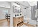 Updated bathroom boasting a wooden vanity, modern mirror, and a shower-tub combo at 1234 29Th St N, St Petersburg, FL 33713