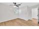 Well-lit bedroom features ceiling fan, window, closet, and light wood flooring at 1234 29Th St N, St Petersburg, FL 33713