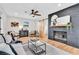 Stylish living room with brick fireplace, wood flooring, and modern decor at 1234 29Th St N, St Petersburg, FL 33713