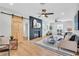 Spacious living room featuring a fireplace and a barn door accent at 1234 29Th St N, St Petersburg, FL 33713