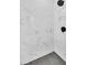 Modern shower with gray tile, updated fixture, and patterned floor at 1234 29Th St N, St Petersburg, FL 33713