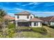 A luxurious backyard with a screened-in patio and beautiful landscaping at 12822 Del Corso Loop, Bradenton, FL 34211