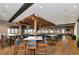 Upscale bar with wooden accents, comfortable seating, and a view of the outdoor area at 12822 Del Corso Loop, Bradenton, FL 34211