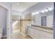 Updated bathroom featuring double sinks, granite countertops, and a tiled walk-in shower at 12822 Del Corso Loop, Bradenton, FL 34211