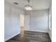 This is a bedroom with hardwood floors and a light fixture at 12822 Del Corso Loop, Bradenton, FL 34211
